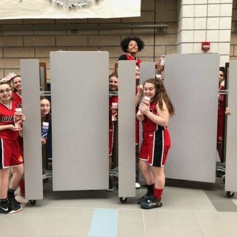 Midget (U16) Girls enjoying a milk after their game.